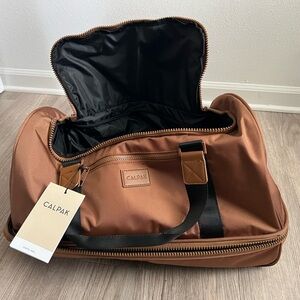 Calpak Stevyn Duffel in camel slightly used